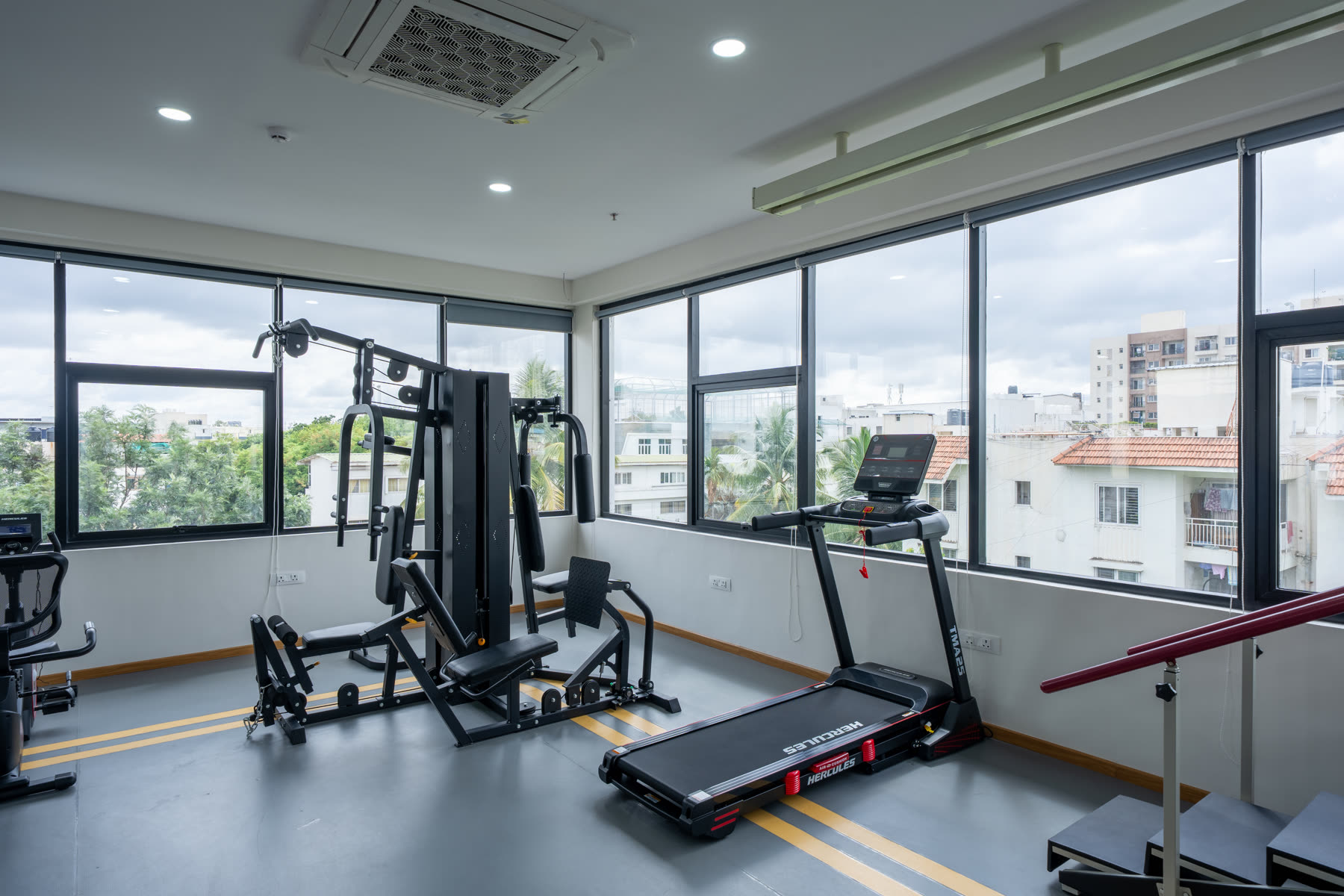 Physiotherapy rehabilitation centre with treadmill, exercise machines and treatment area